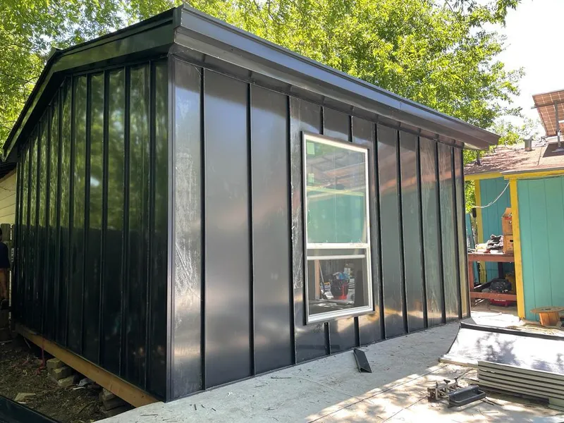 Black standing seam metal wall panels for Metal Roof Installation in Mascotte